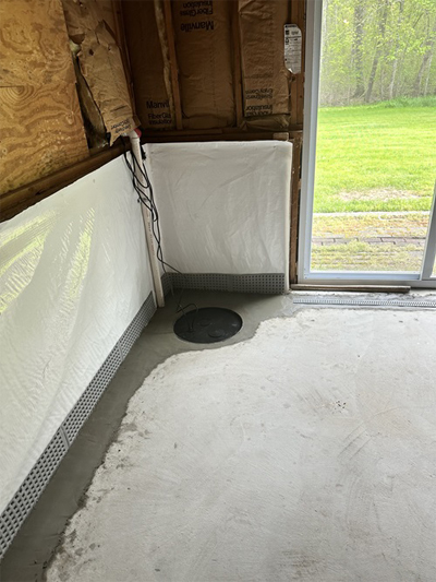 A concrete floor featuring a circular drain